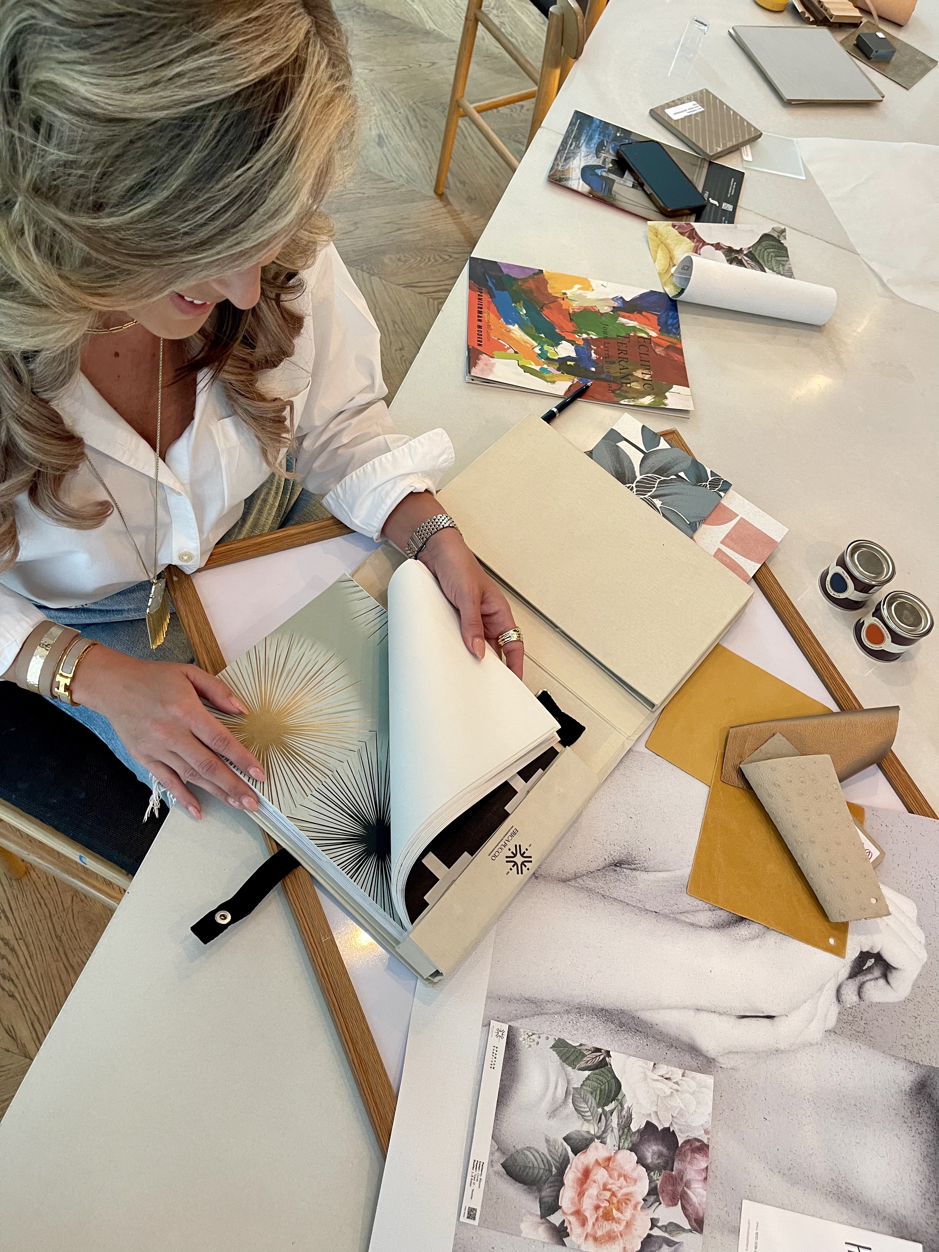 Erica Puccio viewing wallcoverings